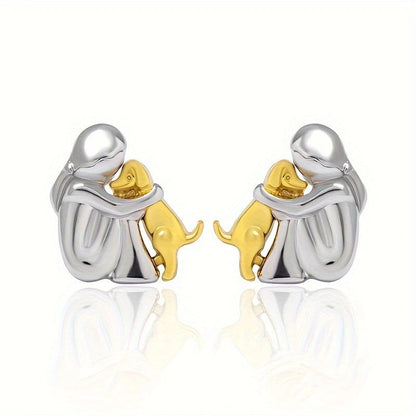 A little girl and a dog embrace earrings