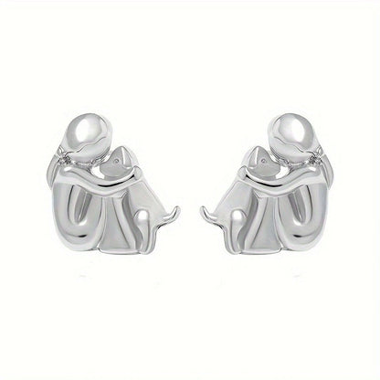 A little girl and a dog embrace earrings